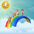 Children standing over the rainbow with smiling sun character Royalty Free Stock Photo