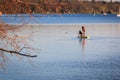 Children at the standing paddling am Ammersee in Bavaria Germany