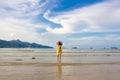 Children standing by the sea