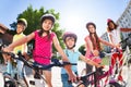 Children standing together with bicycles in summer Royalty Free Stock Photo