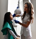 Children stomatologist makes dental procedure x-ray machine. Panoramic radiography for asian kid girl with dentist equipment