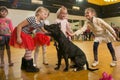 Children stroking a dog