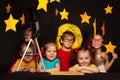 Children studying astronomy with telescope Royalty Free Stock Photo