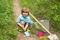 Children summer activities. Carefree childhood. Little Farmer boy examining Common fig crop in plantation or field. Royalty Free Stock Photo