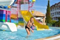 Children swim in pool outside in  water park. cheerful kids active water sports in summer. children`s holidays at  sea Royalty Free Stock Photo