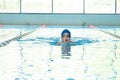 Khabarovsk, Russia - May, 19, 2019: children swimming Breaststroke. Indoor swimming pool with clear blue water Royalty Free Stock Photo