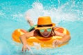 Children swimming on floating ring in pool. Kids summer portrait. Summer travelling. Royalty Free Stock Photo