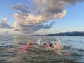 Children swimming. Little girls having fun on family summer vacation in tropical resort. Beach and water Royalty Free Stock Photo