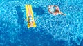 Children in swimming pool aerial drone view fom above, happy kids swim on inflatable ring donut and mattress, girls have fun Royalty Free Stock Photo