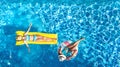 Children in swimming pool aerial drone view fom above, happy kids swim on inflatable ring donut and mattress, girls have fun Royalty Free Stock Photo