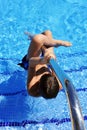 Children in swimming pool, summer vacation