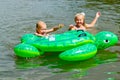 Children swimming in the river with inflatable tur Royalty Free Stock Photo