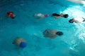 Children swimming training in a swimming pool. float exercise for buoyancy and proper breathing. deliverance of a person