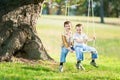 Children on a swing on a nature