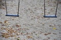 Children swings in the park.Playground at Automn Royalty Free Stock Photo