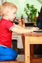 Little boy using laptop computer playing games Royalty Free Stock Photo