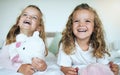 Children, teddy bear and happy sisters playing together in their bedroom at their family home. Happiness, smile and bond