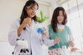 Children teen role playing scientist at fun science chemical lab workshop for learning education in school Royalty Free Stock Photo