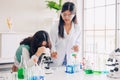 Children teen role playing scientist at fun science chemical lab workshop for learning education in school Royalty Free Stock Photo