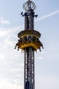 Children and teens\' legs hanging from fair ride in air