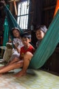 Children in their house in a Cambodian fishing village Royalty Free Stock Photo