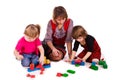 Children and their mother building with cubes Royalty Free Stock Photo