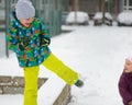 Children throwing snowballs Royalty Free Stock Photo