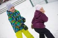 Children throwing snowballs Royalty Free Stock Photo