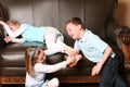 Children tickling feet Royalty Free Stock Photo