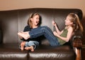 Children tickling feet