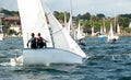 Children about to capsize a small racing sailboat. Commercial use image