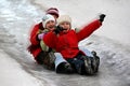 Children tobogganing Royalty Free Stock Photo