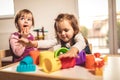 Children toddlers girls play toys at home