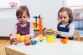 Children girls play toys at home, kindergarten or nursery Royalty Free Stock Photo