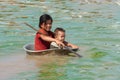 Children in the Tonle Sap lake in Cambodia Royalty Free Stock Photo