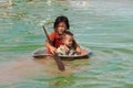 Children in the Tonle Sap lake in Cambodia Royalty Free Stock Photo