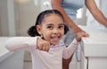 Children, toothbrush and toothpaste with a girl brushing teeth in the bathroom at home for dental hygiene or care