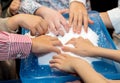 Children play with artificial snow