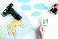 Children tourism outfit with map and camera on white background