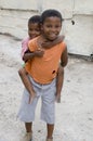 Children in Township in S.A. South African children playing piggyback. in township near Cape Town