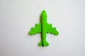 Children toy - green plastic plane with a red propeller, without a pilot, isolated on a white background Royalty Free Stock Photo