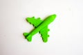 Children toy - green plastic plane with a red propeller, without a pilot, isolated on a white background Royalty Free Stock Photo