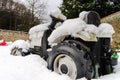 Children toy tractor over the snow