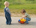 Children with a toy truck Royalty Free Stock Photo