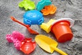 Children toys: bucker, shovel, sand molds lie on the sand. Children's beach sand toys. Royalty Free Stock Photo