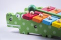 Children Toy : A close-up view of a colorful children`s bell  toy  . Which is made in the shape of an alligator. Royalty Free Stock Photo