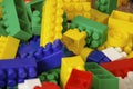 Children toys. Multi colored plastic constructor with blocks for building houses and cars, plain, bus with figures of people Royalty Free Stock Photo