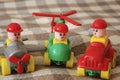 Children toys. Multi colored plastic constructor with blocks for building houses and cars, plain, bus with figures of people Royalty Free Stock Photo