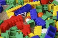 Children toys. Multi colored plastic constructor with blocks for building houses and cars, plain, bus with figures of people Royalty Free Stock Photo