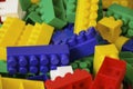 Children toys. Multi colored plastic constructor with blocks for building houses and cars, plain, bus with figures of people Royalty Free Stock Photo